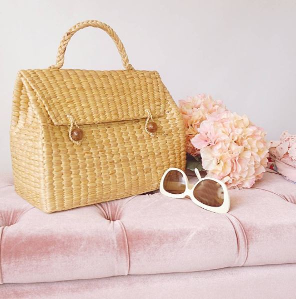 Triangle straw handbag with chic sunglasses